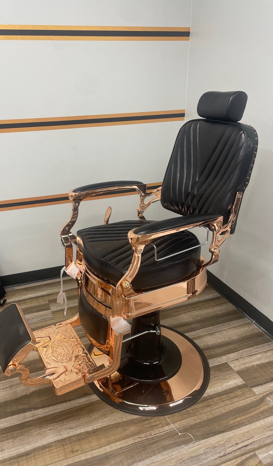 Rose-gold and black leather barber chair at Fathers Barber Salon, Laguna Hills