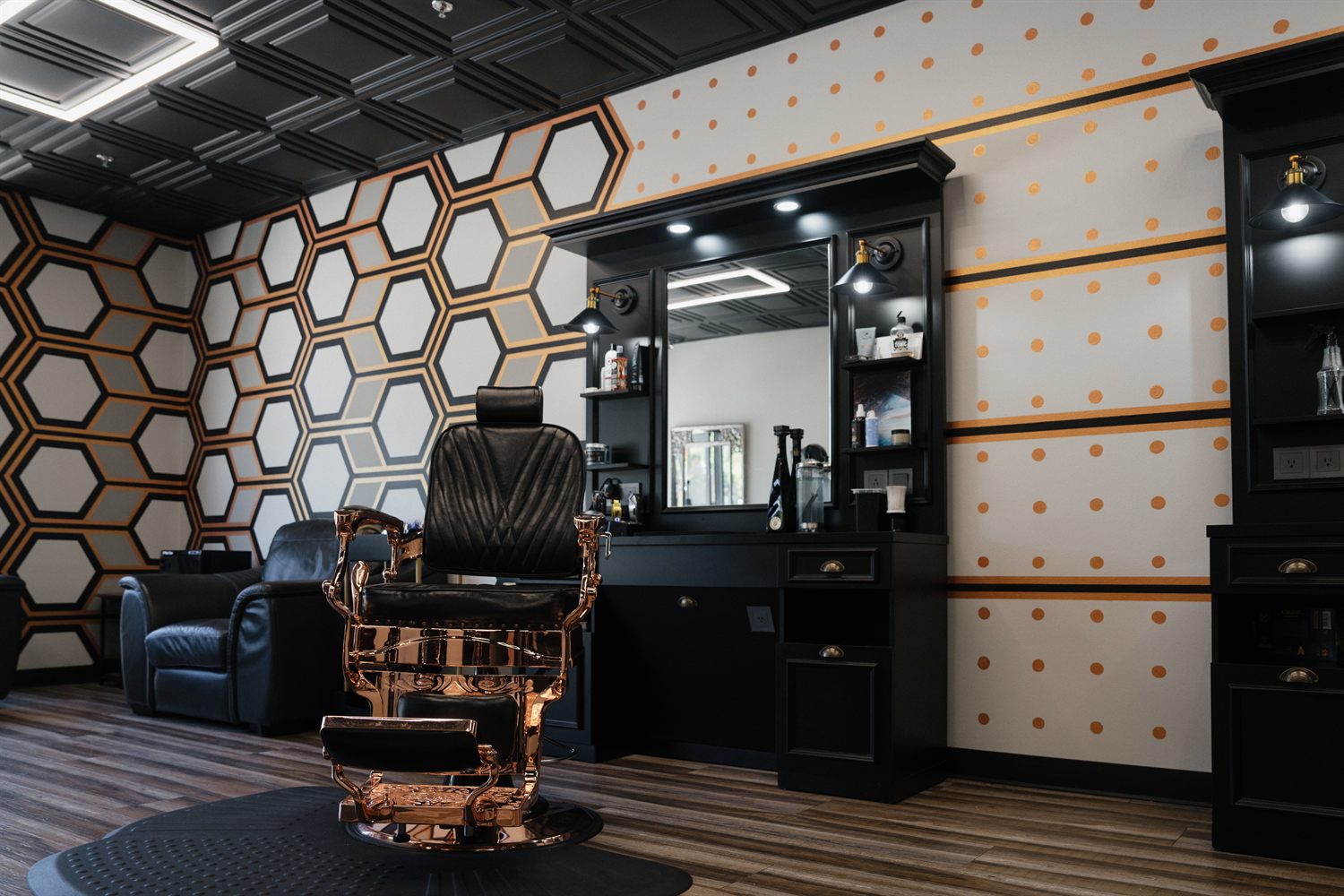Barber station against the copper honeycomb feature wall